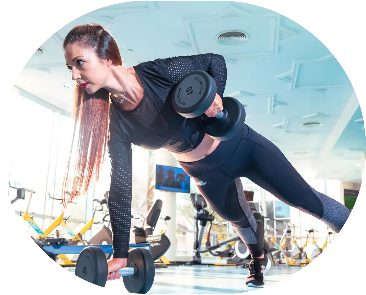 Woman with dumbbells exercising