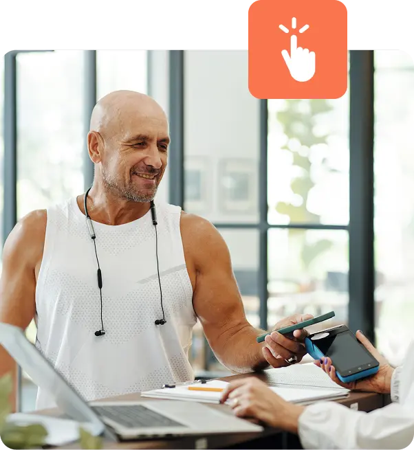 Man with earbuds checking out