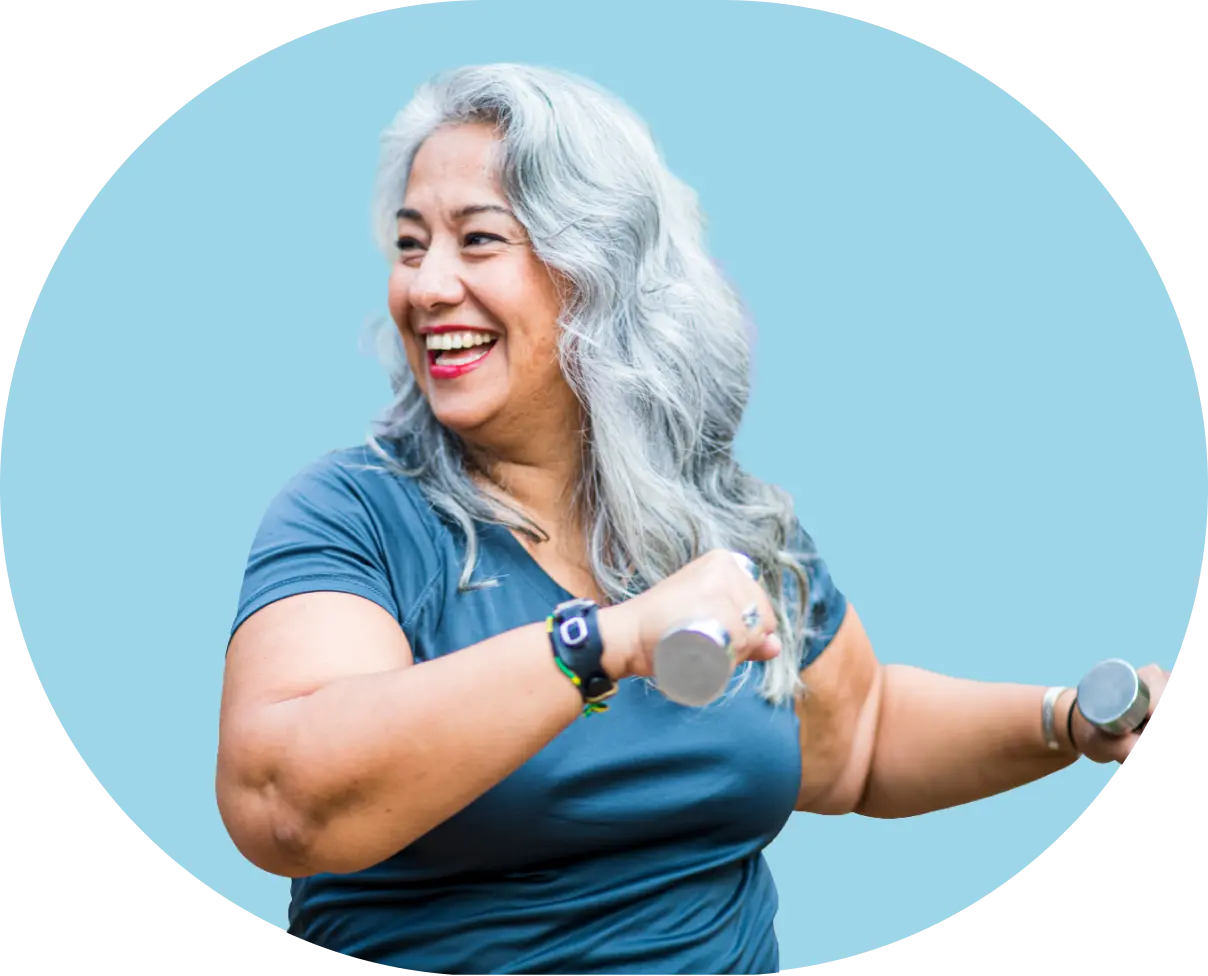 Woman with dumbbells smiling